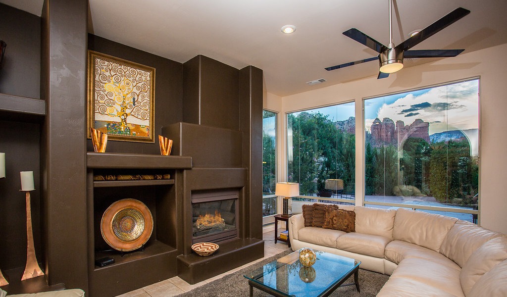 Living room framed by red rock views